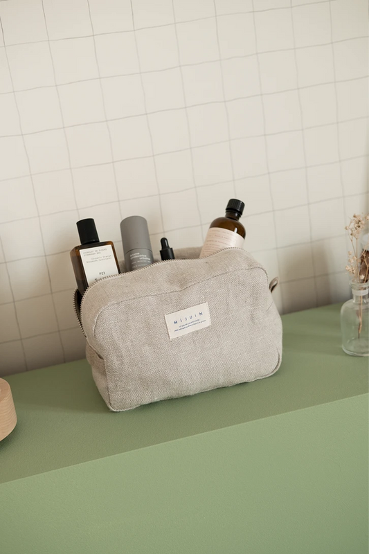 La trousse de toilette beige