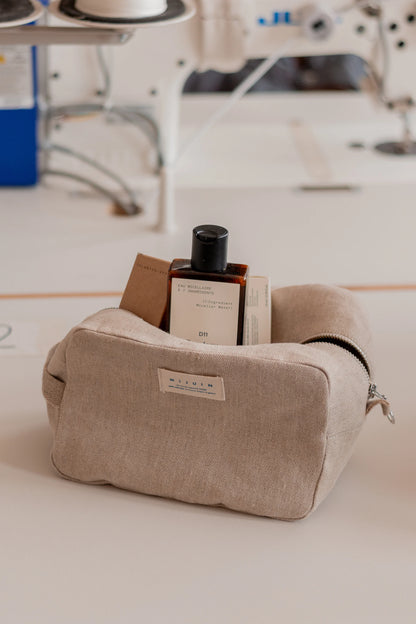 La trousse de toilette beige